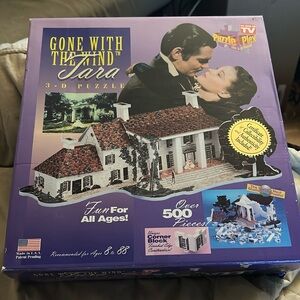 Brand new never opened done with the wind 3-D puzzle